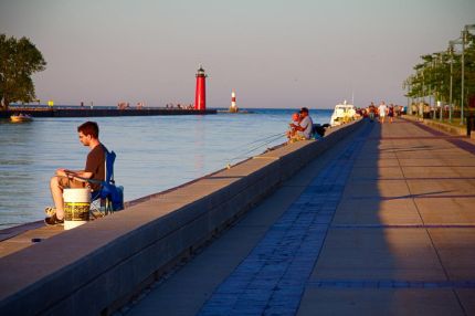 Lighthouse and walkway by the lake