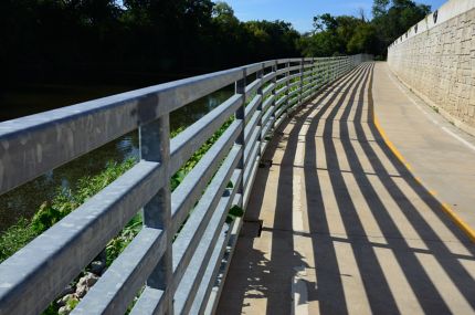 DRP Trail steel railings and shadows on riverwalk section