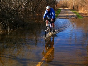 Keeping feet dry pedaling through flooded trail